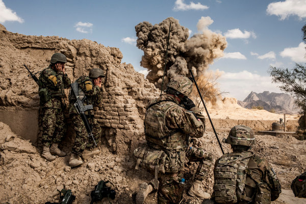 A part from being sujected to constant attack from the Taliban the US Military is also subjected to daily Powerpoint presentations. Photo Credit: Bryan Denton for The New York Times 